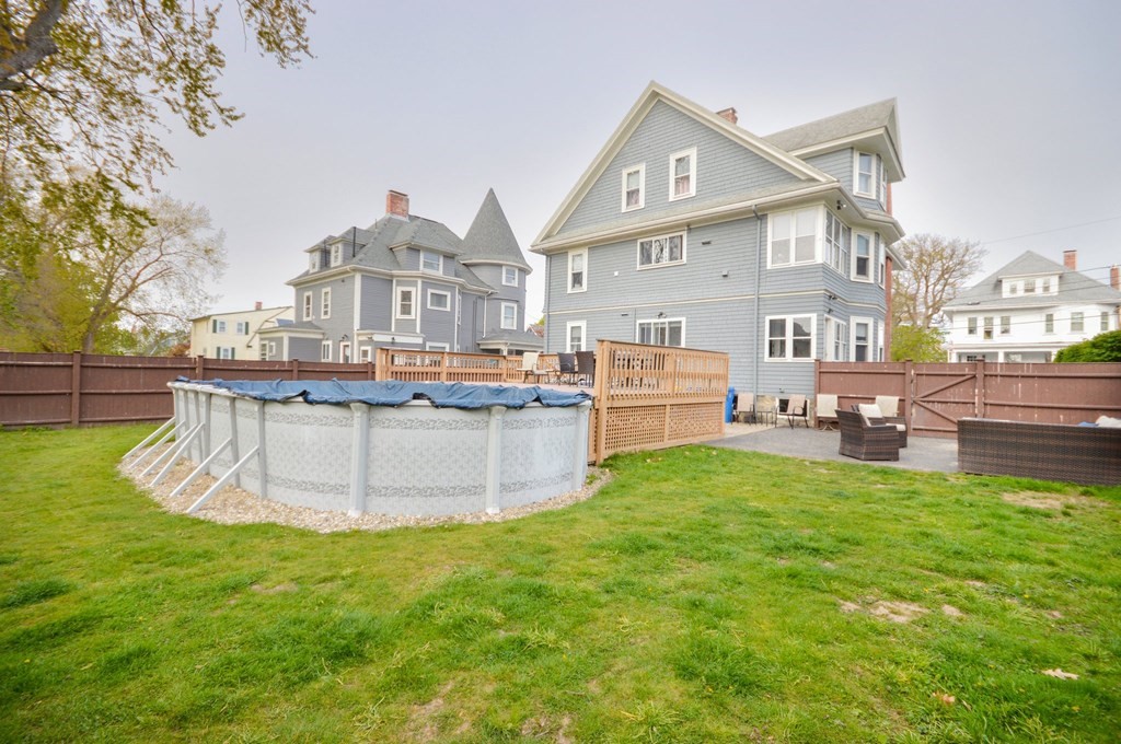183 Cottage Park Road Winthrop, MA 02152 - Photo 29 of 35 a view of a house with a backyard porch and sitting area