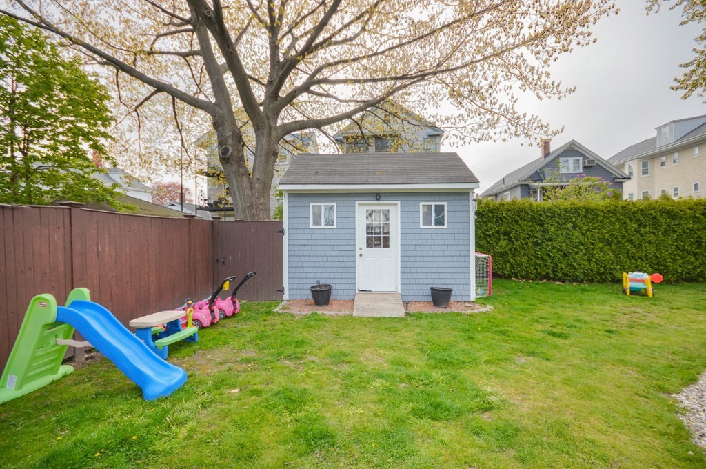183 Cottage Park Road Winthrop, MA 02152 - Photo 31 of 35 a view of a house with a backyard and a tree