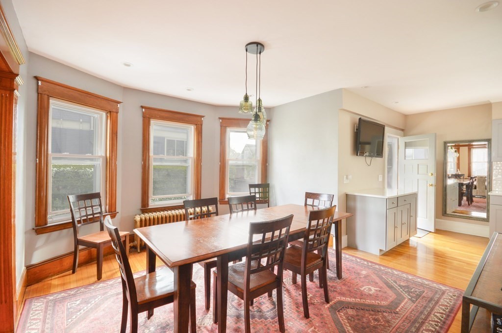 183 Cottage Park Road Winthrop, MA 02152 - Photo 8 of 35 a dining room with furniture window and wooden floor