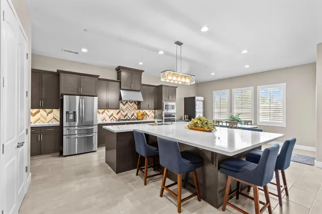 a view of a dining room with furniture and windows