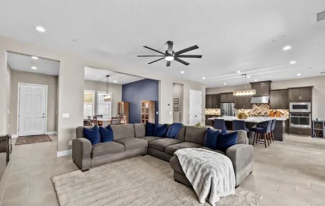 a view of a dining room with furniture and window