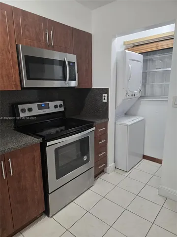 a kitchen with a stove and a microwave