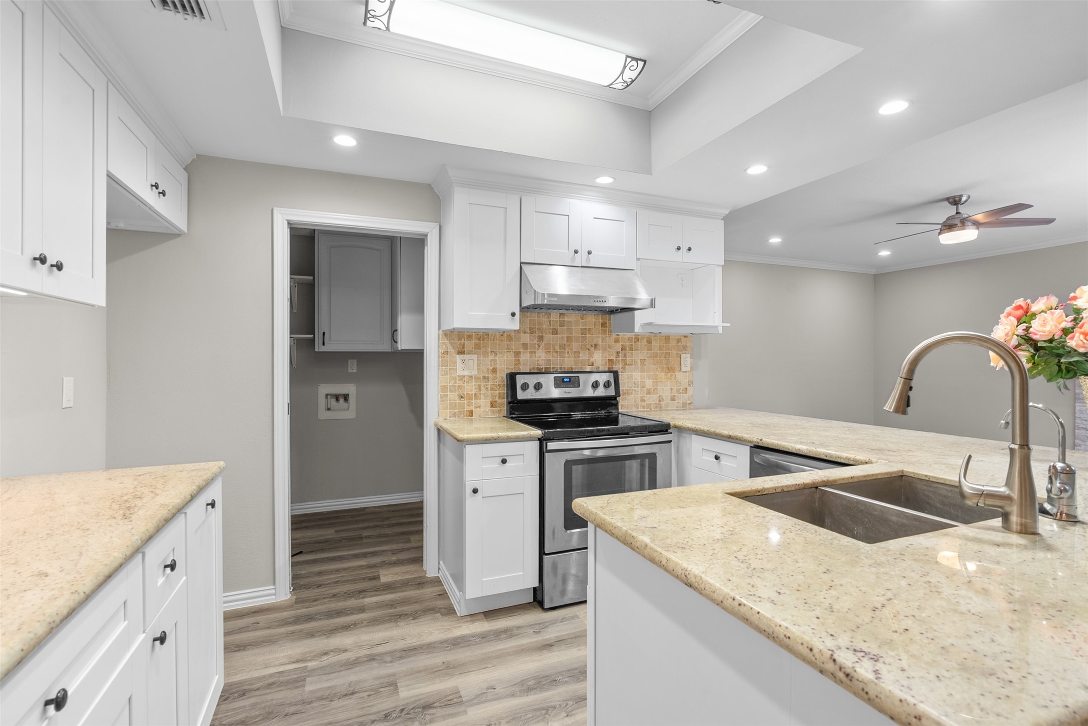 161 Litchfield Lane Houston, TX 77024 - Photo 14 of 30 a kitchen with a stove sink and cabinets