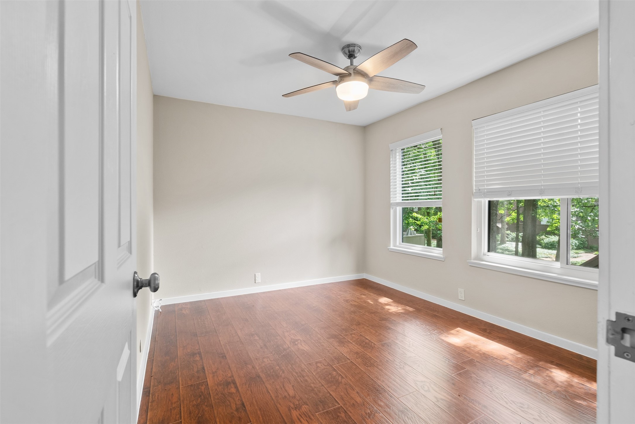 161 Litchfield Lane Houston, TX 77024 - Photo 17 of 30 an empty room with windows and fan