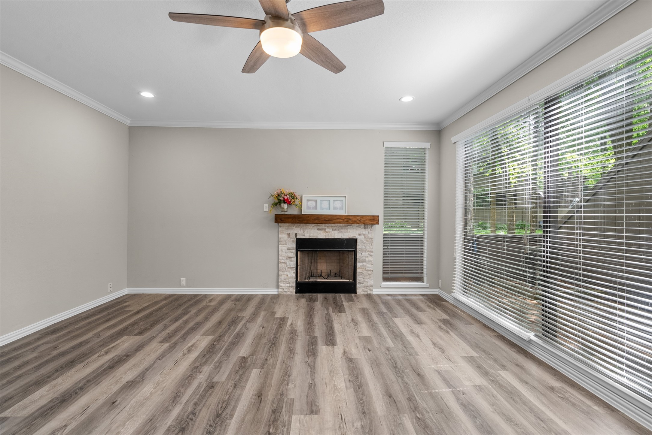 161 Litchfield Lane Houston, TX 77024 - Photo 4 of 30 a view of an empty room with a window and fire place