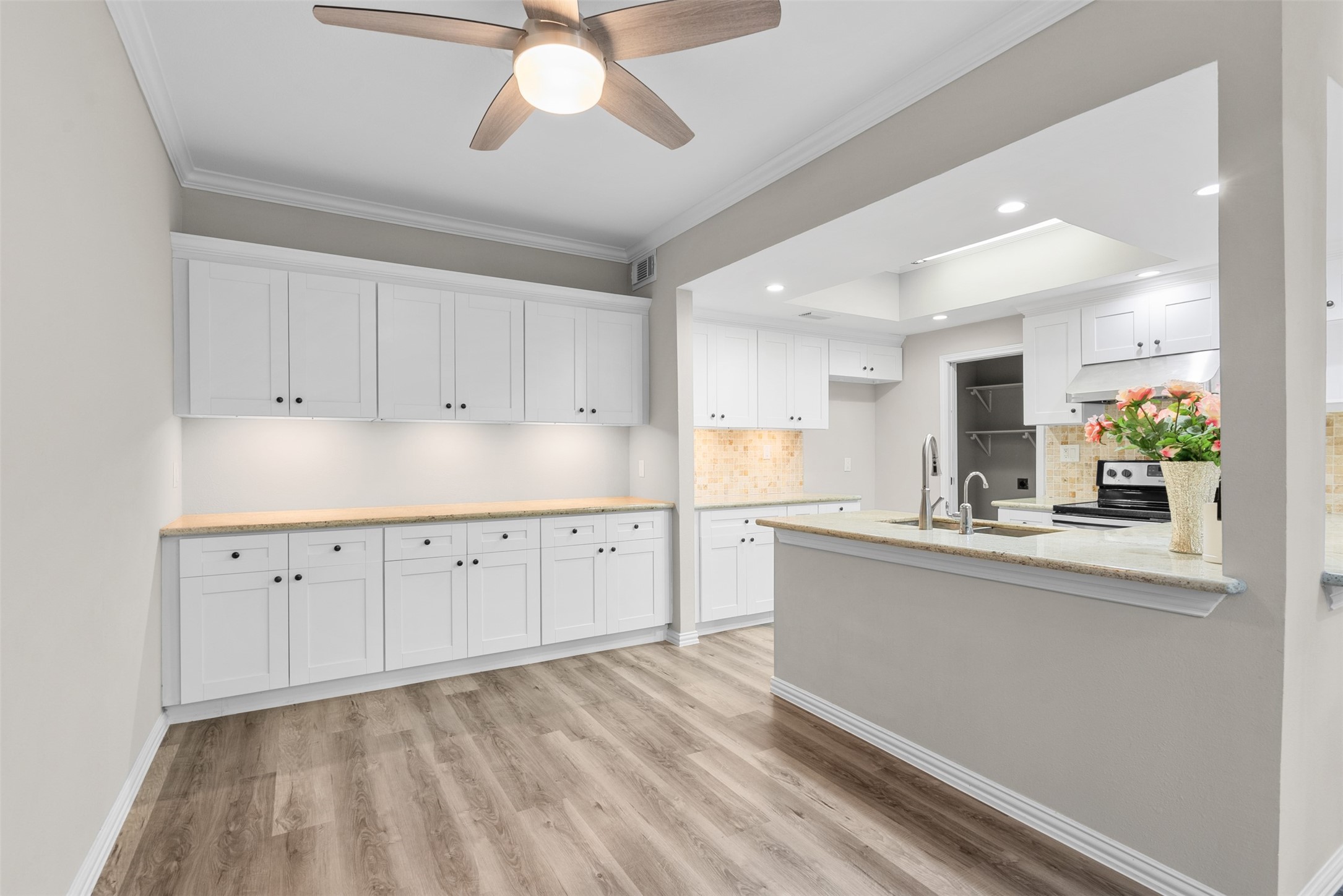 161 Litchfield Lane Houston, TX 77024 - Photo 7 of 30 a kitchen with granite countertop cabinets stainless steel appliances and a chandelier