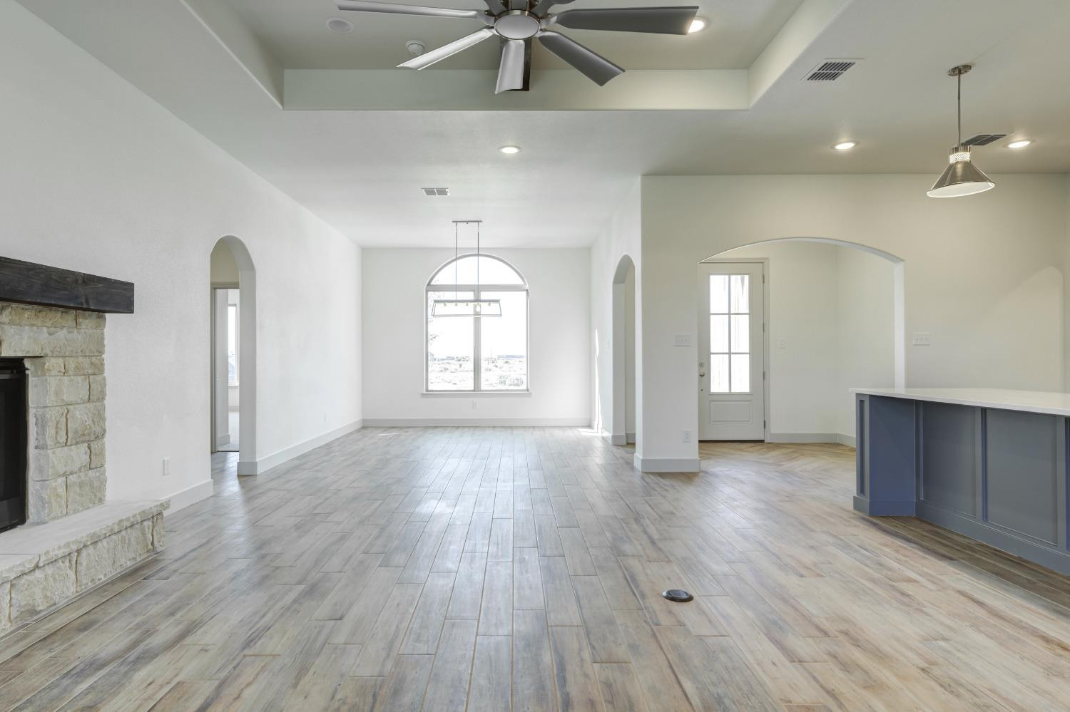 4608 140th Street Lubbock, TX 79424 - Photo 12 of 49 wooden floor in an empty room with a window