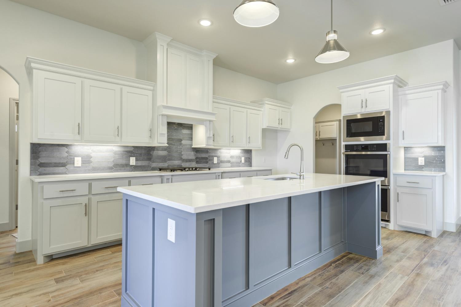 4608 140th Street Lubbock, TX 79424 - Photo 15 of 49 a kitchen with stainless steel appliances granite countertop a sink stove and refrigerator