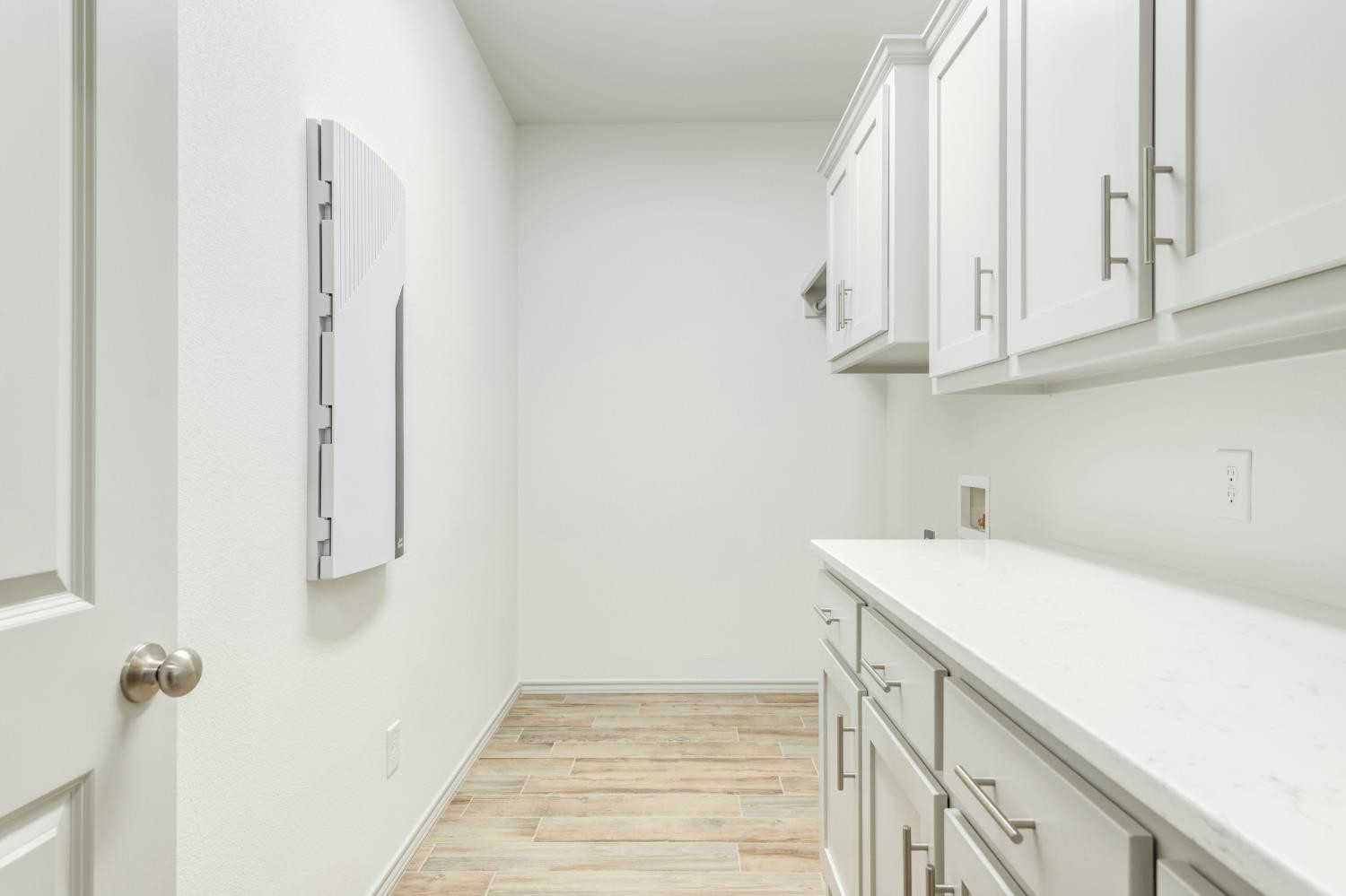 4608 140th Street Lubbock, TX 79424 - Photo 24 of 49 a bathroom with a sink and a mirror