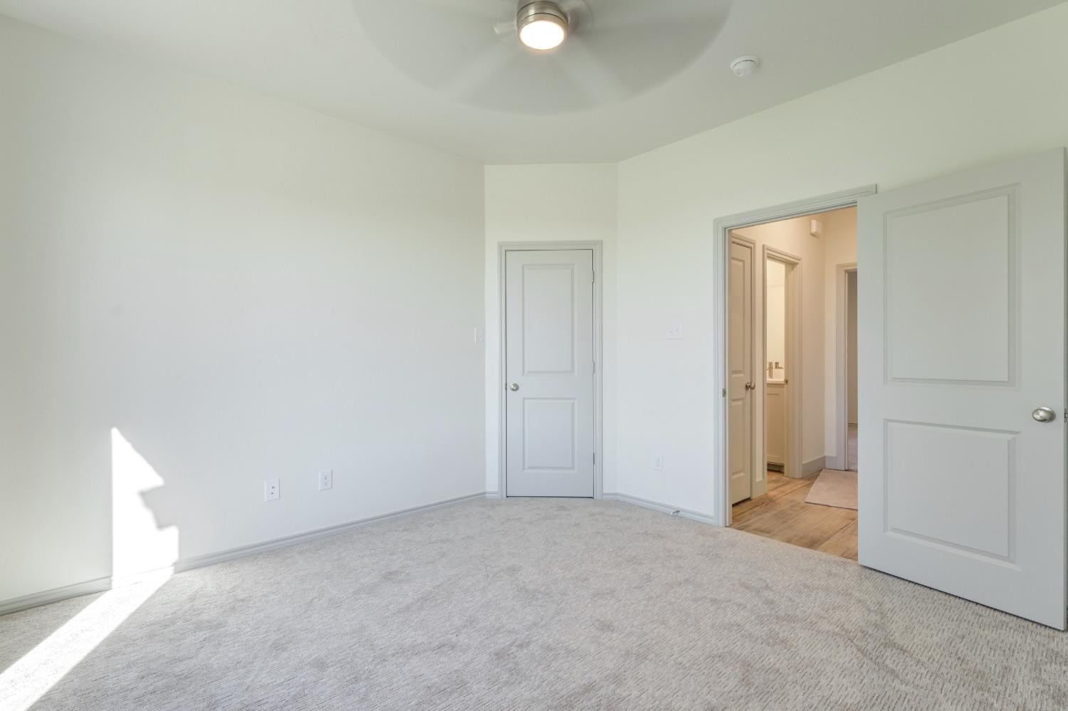 4608 140th Street Lubbock, TX 79424 - Photo 28 of 49 an empty room with closet and mirror