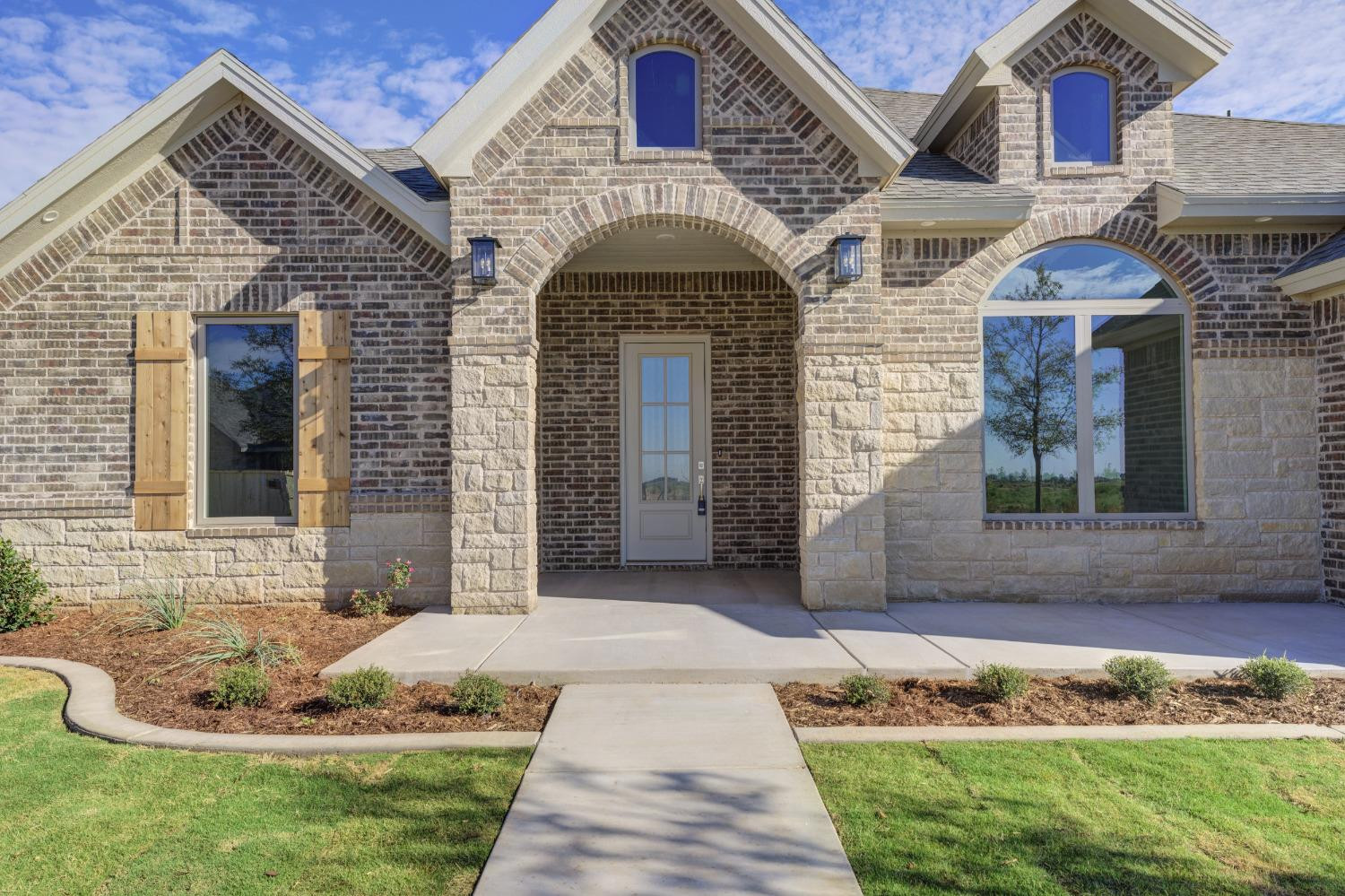 4608 140th Street Lubbock, TX 79424 - Photo 3 of 49 a front view of a house with a yard
