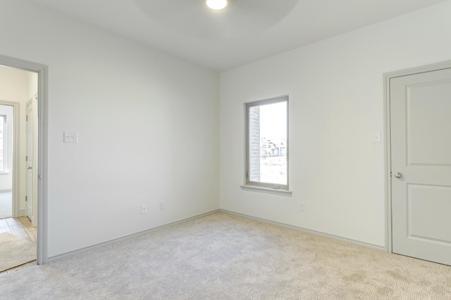 4608 140th Street Lubbock, TX 79424 - Photo 32 of 49 an empty room with windows and closet