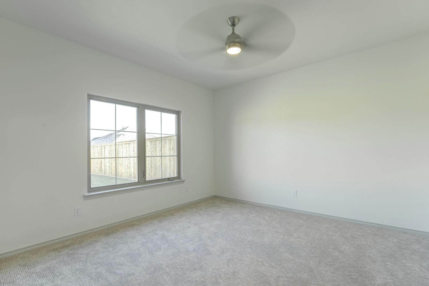4608 140th Street Lubbock, TX 79424 - Photo 33 of 49 an empty room with a window