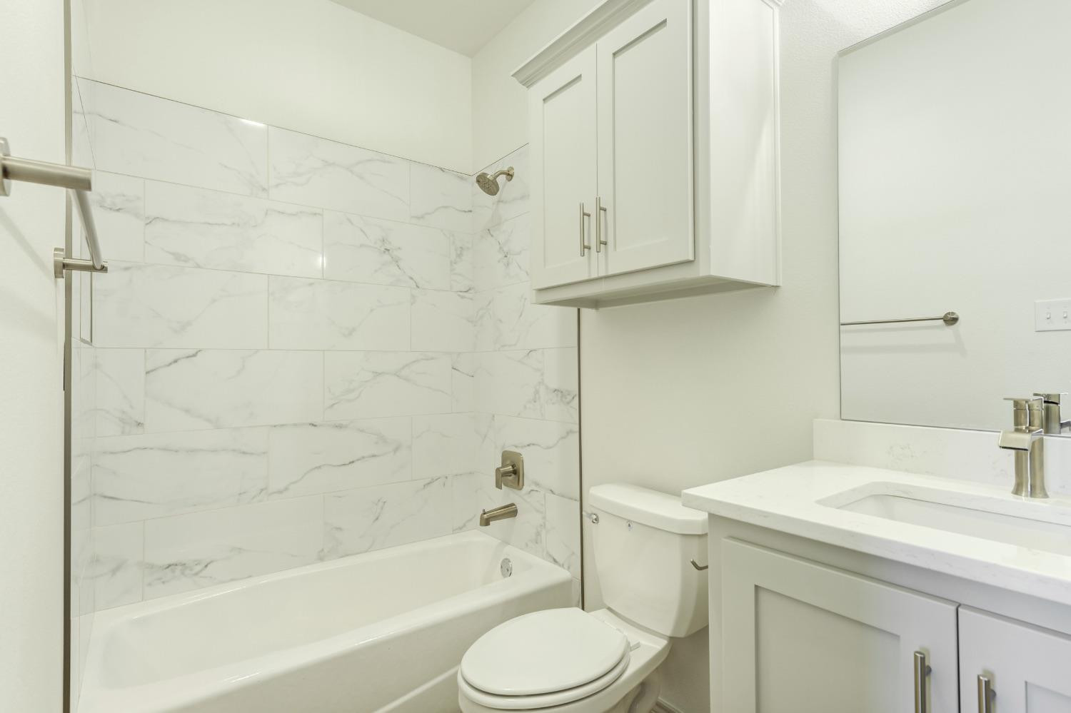 4608 140th Street Lubbock, TX 79424 - Photo 36 of 49 a bathroom with a sink toilet and shower