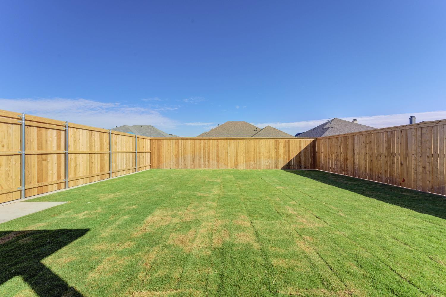 4608 140th Street Lubbock, TX 79424 - Photo 48 of 49 a view of yard with swimming pool and wooden fence