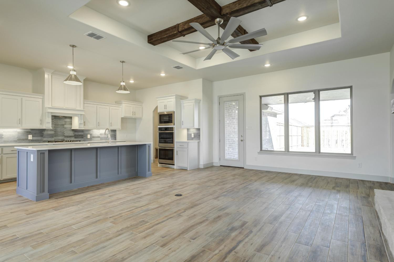 4608 140th Street Lubbock, TX 79424 - Photo 9 of 49 a view of a kitchen with a sink and a window