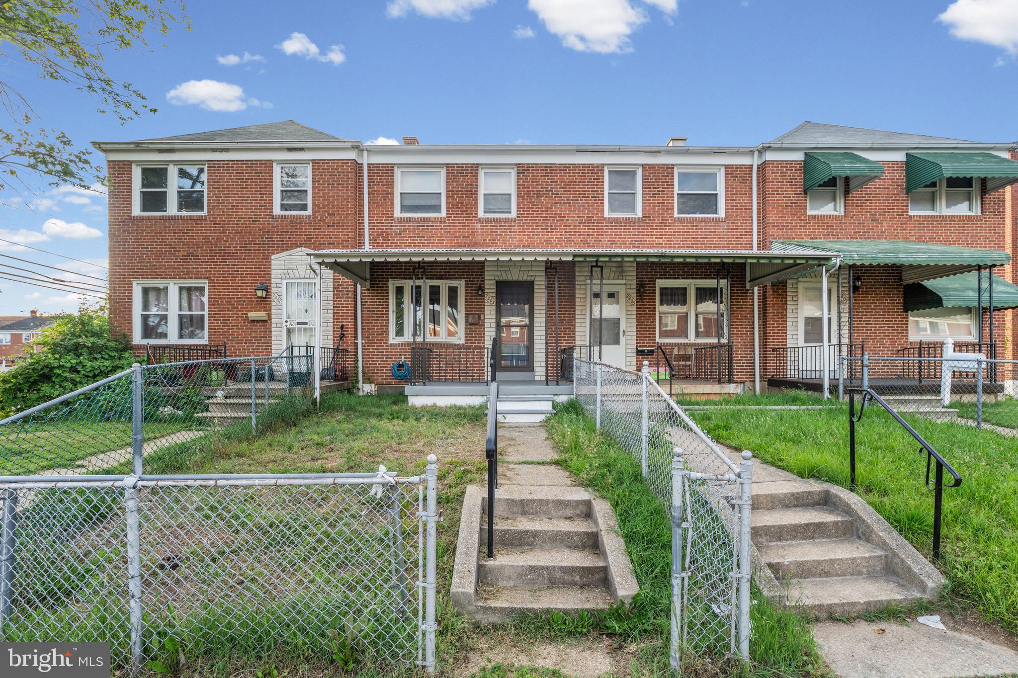 2203 Redthorn Road Baltimore, MD 21220 - Photo 2 of 23 a front view of a house with a yard