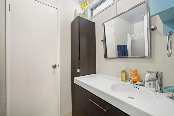 a bathroom with a sink and a mirror