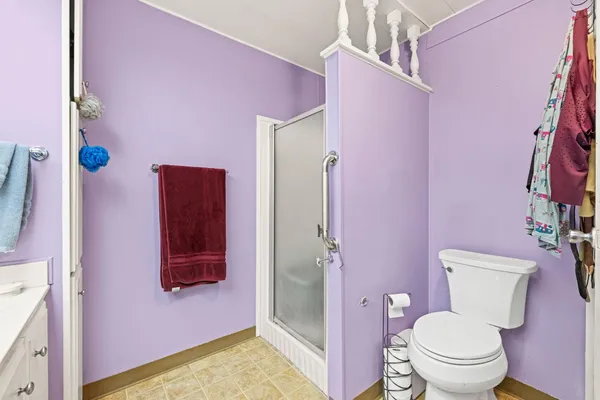 a bathroom with a toilet sink and shower