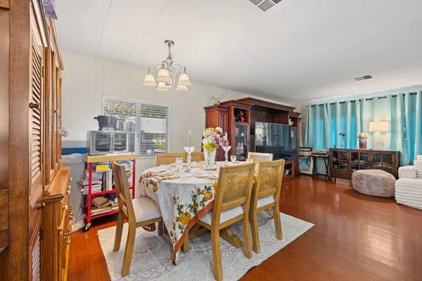 a view of a dining room with furniture window and outside view