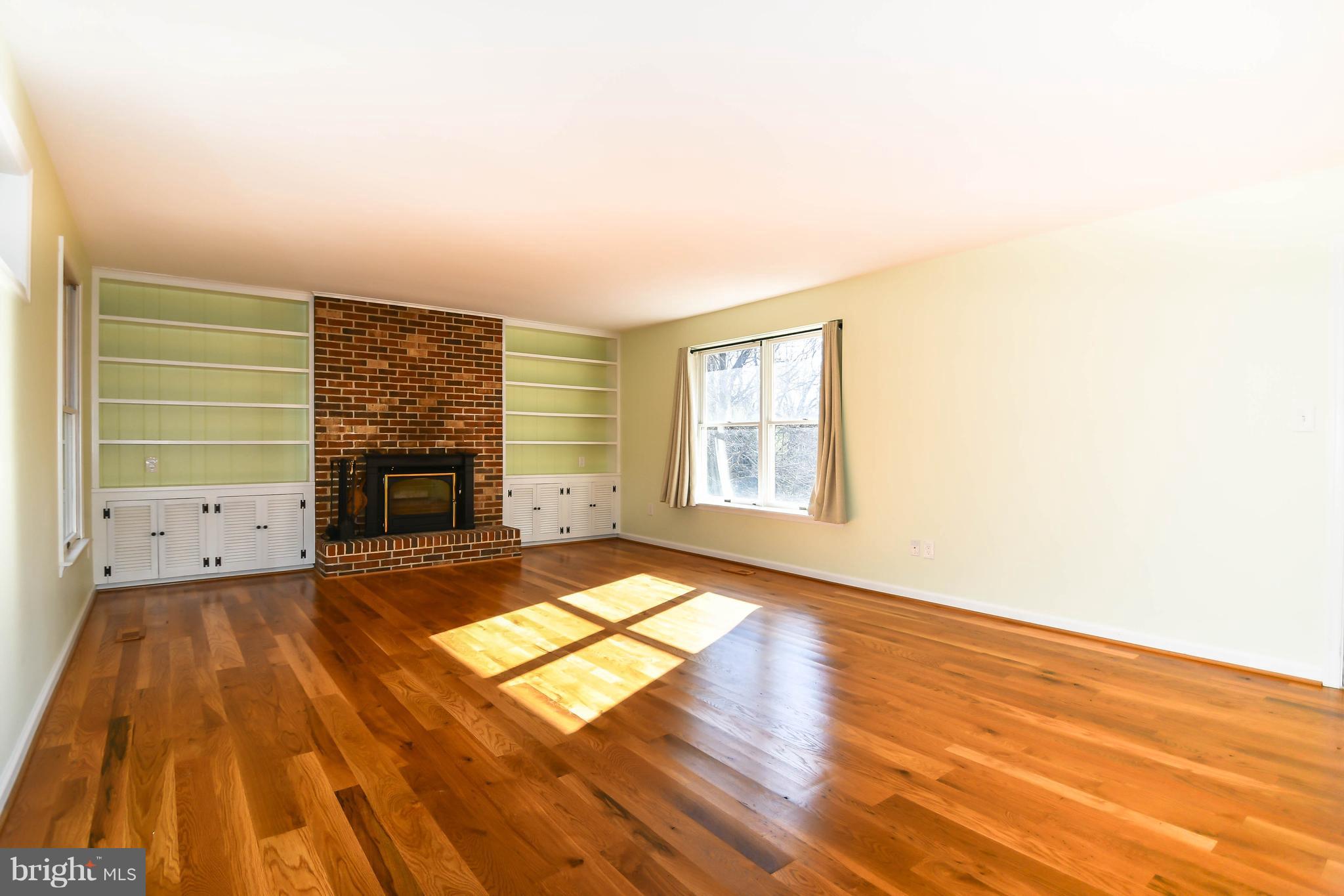 13623 Bardon Road Phoenix, MD 21131 - Photo 12 of 35 Family Room with Fireplace & Built-in Shelving