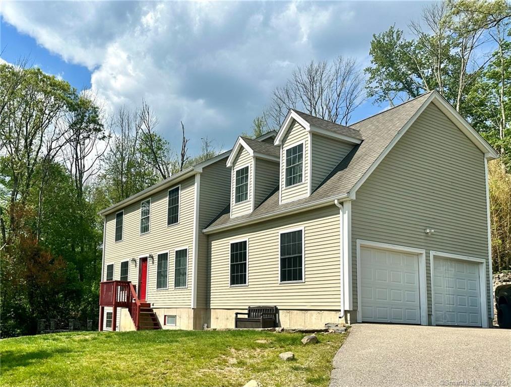 62 Terry Road Ledyard, CT 06335 - Photo 1 of 1 a front view of a house with garden