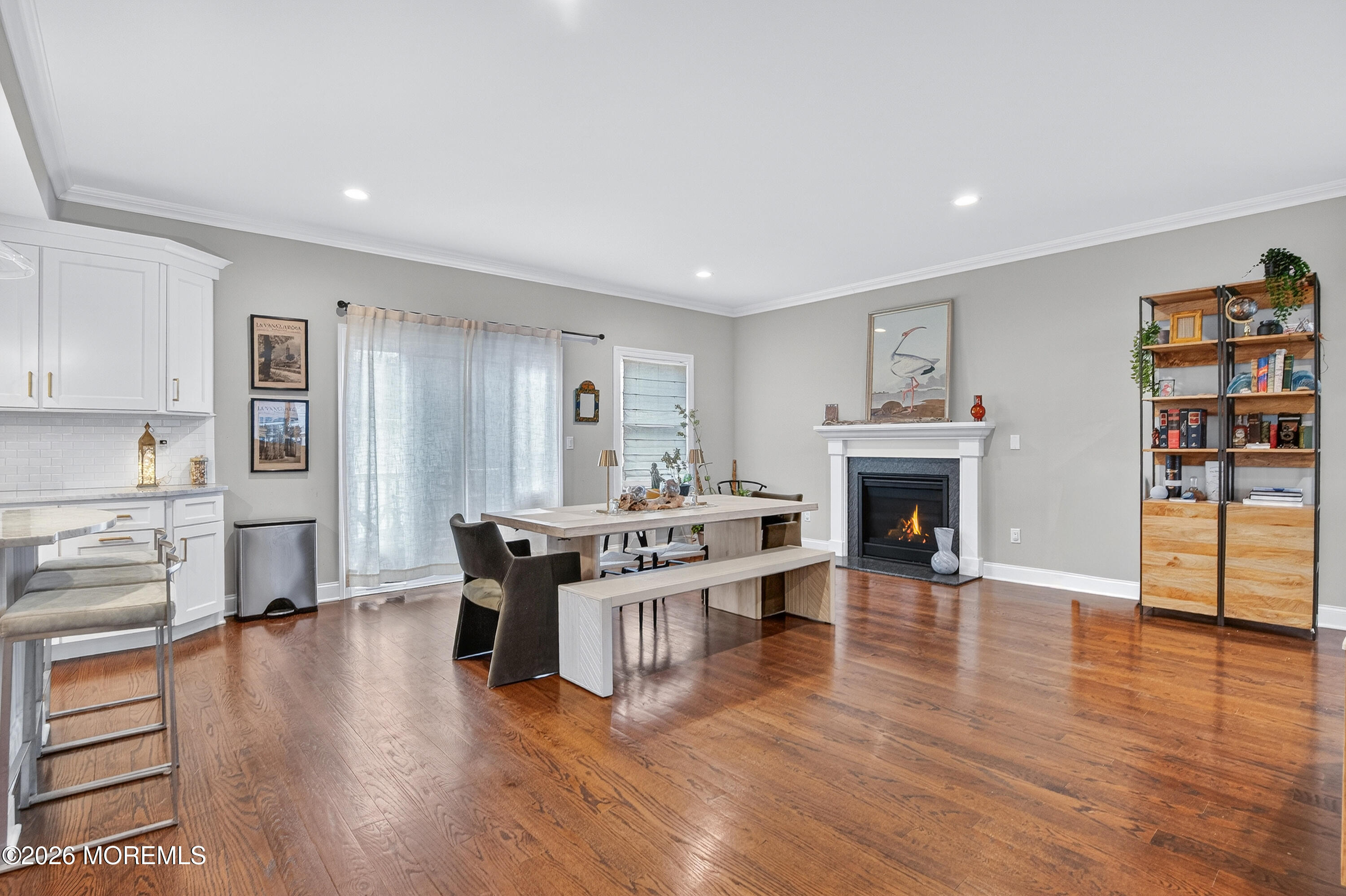 27 5th Street Highlands, NJ 07732 - Photo 2 of 62 a living room with furniture a fireplace and a kitchen view