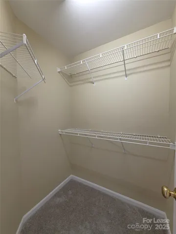 a view of a room with racks on the wall