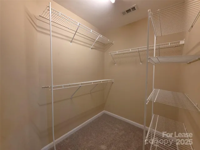 a view of a room with racks on the wall