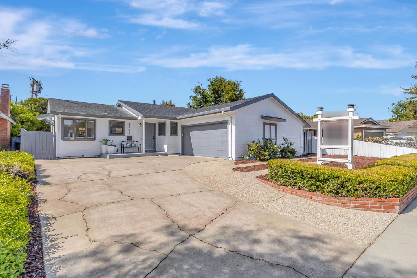 6722 Bollinger Road San Jose, CA 95129 - Photo 1 of 33 a front view of a house with a yard and potted plants