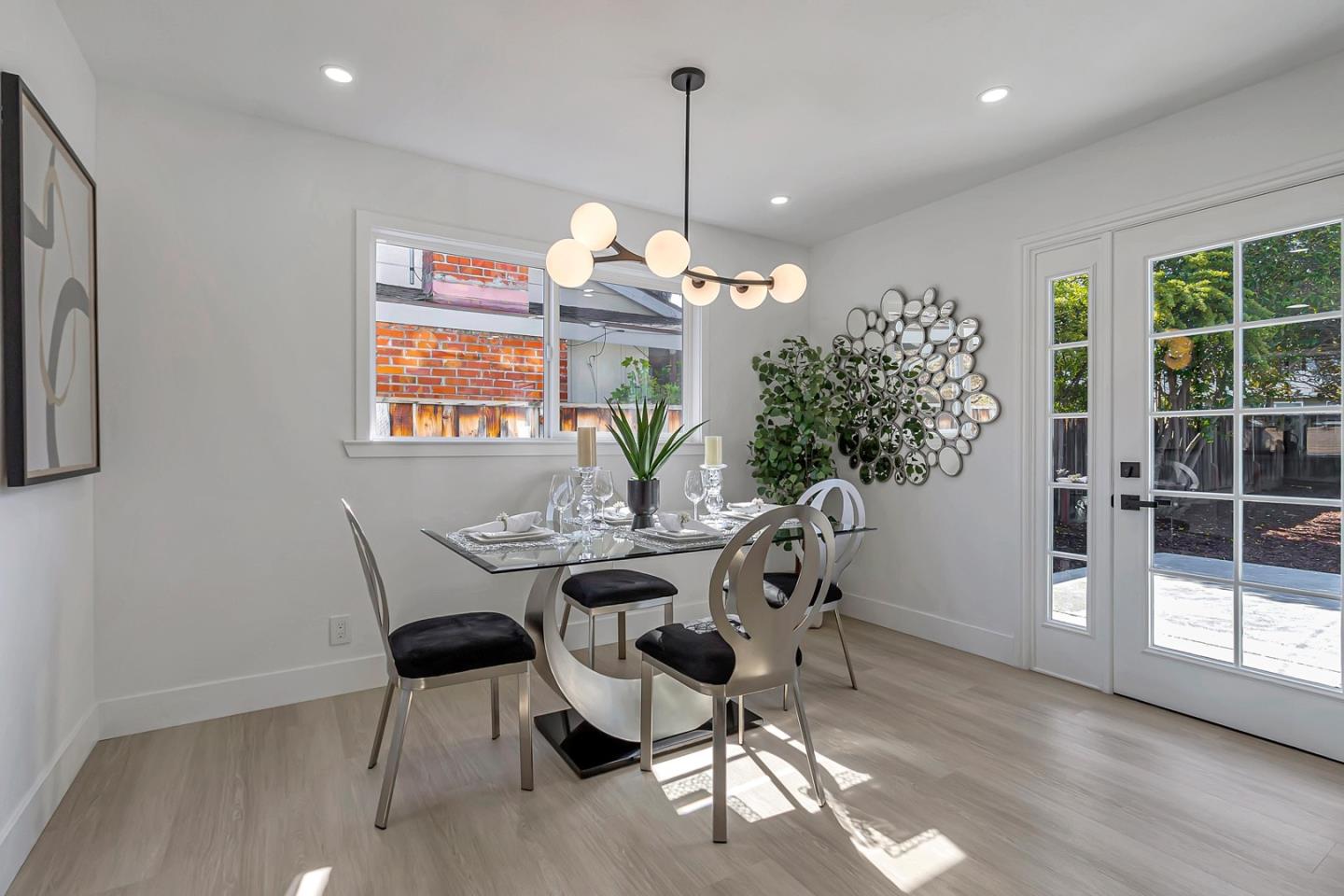 6722 Bollinger Road San Jose, CA 95129 - Photo 13 of 33 a dining room with furniture a chandelier and wooden floor