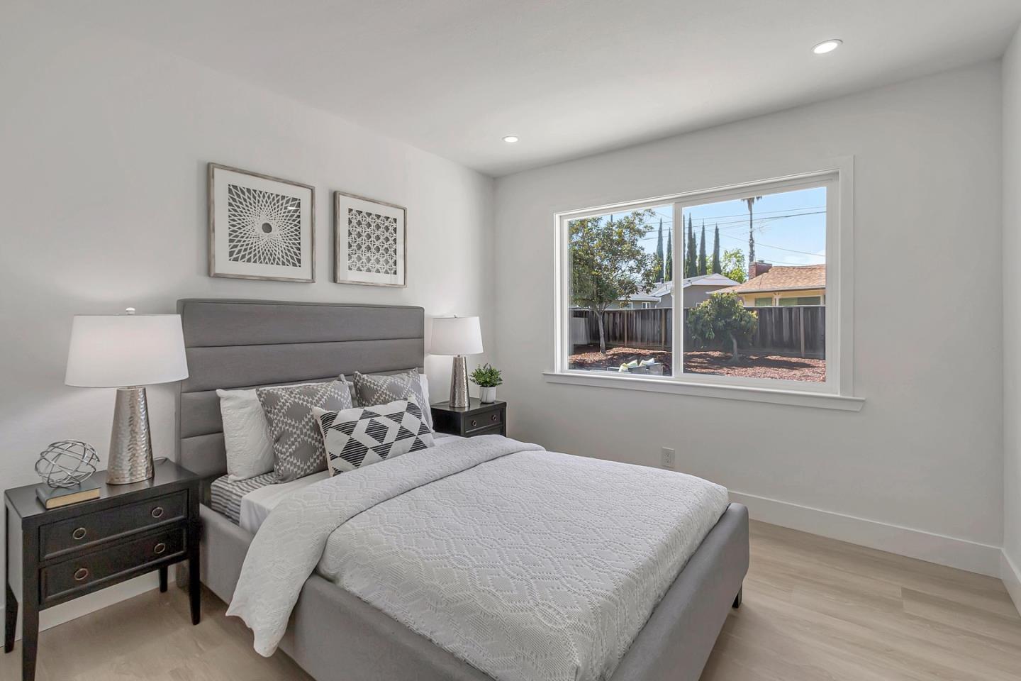 6722 Bollinger Road San Jose, CA 95129 - Photo 16 of 33 a bedroom with a bed and a window