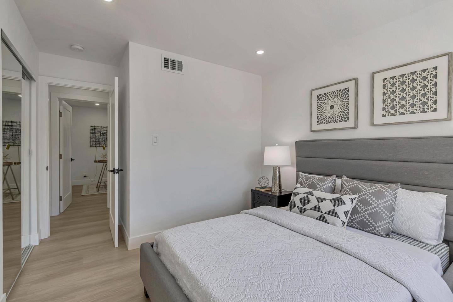 6722 Bollinger Road San Jose, CA 95129 - Photo 17 of 33 a bedroom with a bed and a refrigerator