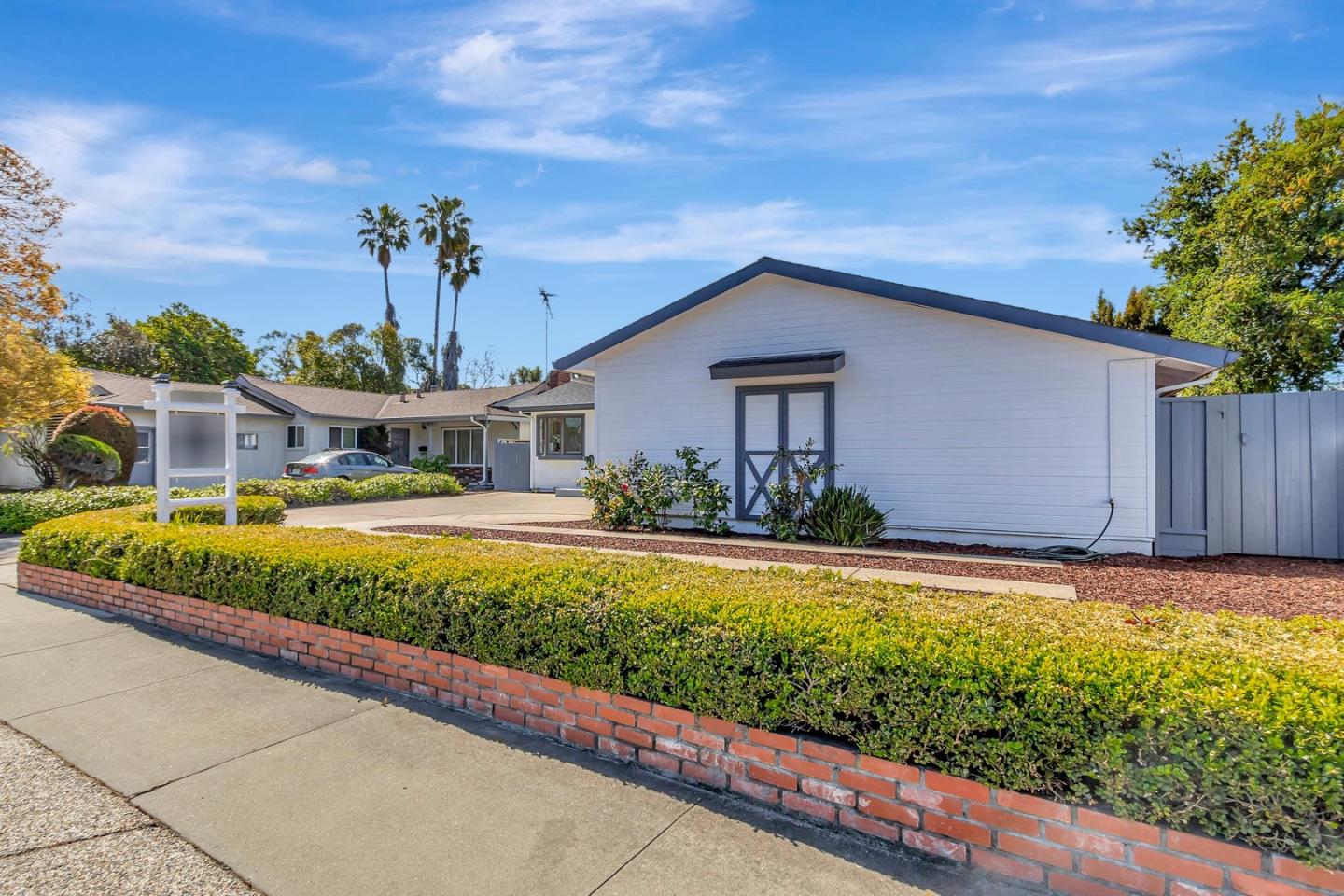 6722 Bollinger Road San Jose, CA 95129 - Photo 2 of 33 a front view of a house with a yard