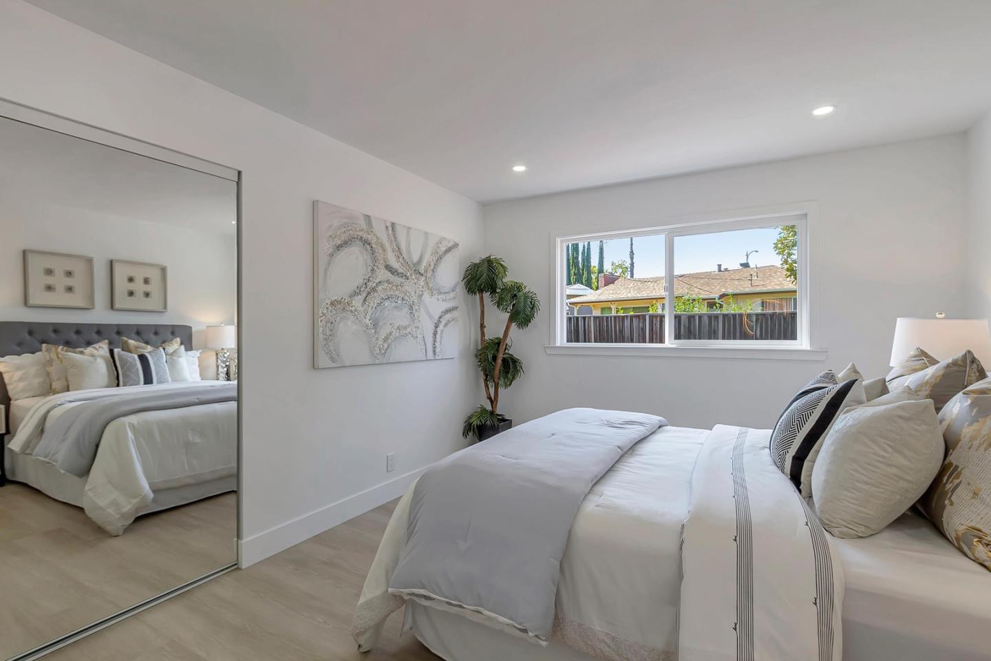 6722 Bollinger Road San Jose, CA 95129 - Photo 23 of 33 a bedroom with a bed and a window
