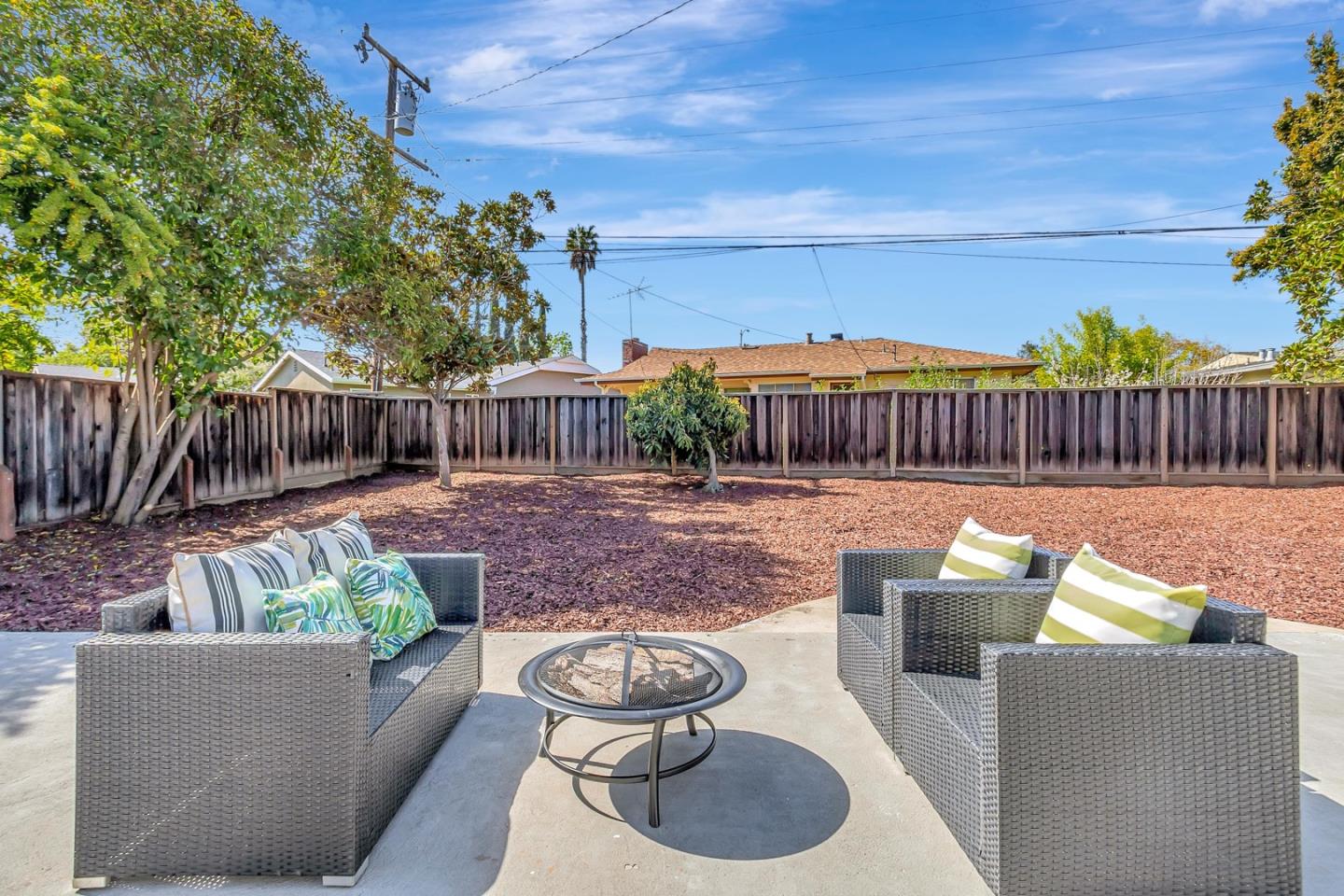 6722 Bollinger Road San Jose, CA 95129 - Photo 30 of 33 a view of a patio with couches chairs and a fire pit