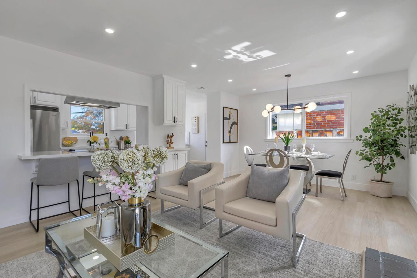 6722 Bollinger Road San Jose, CA 95129 - Photo 6 of 33 a living room with furniture and a chandelier