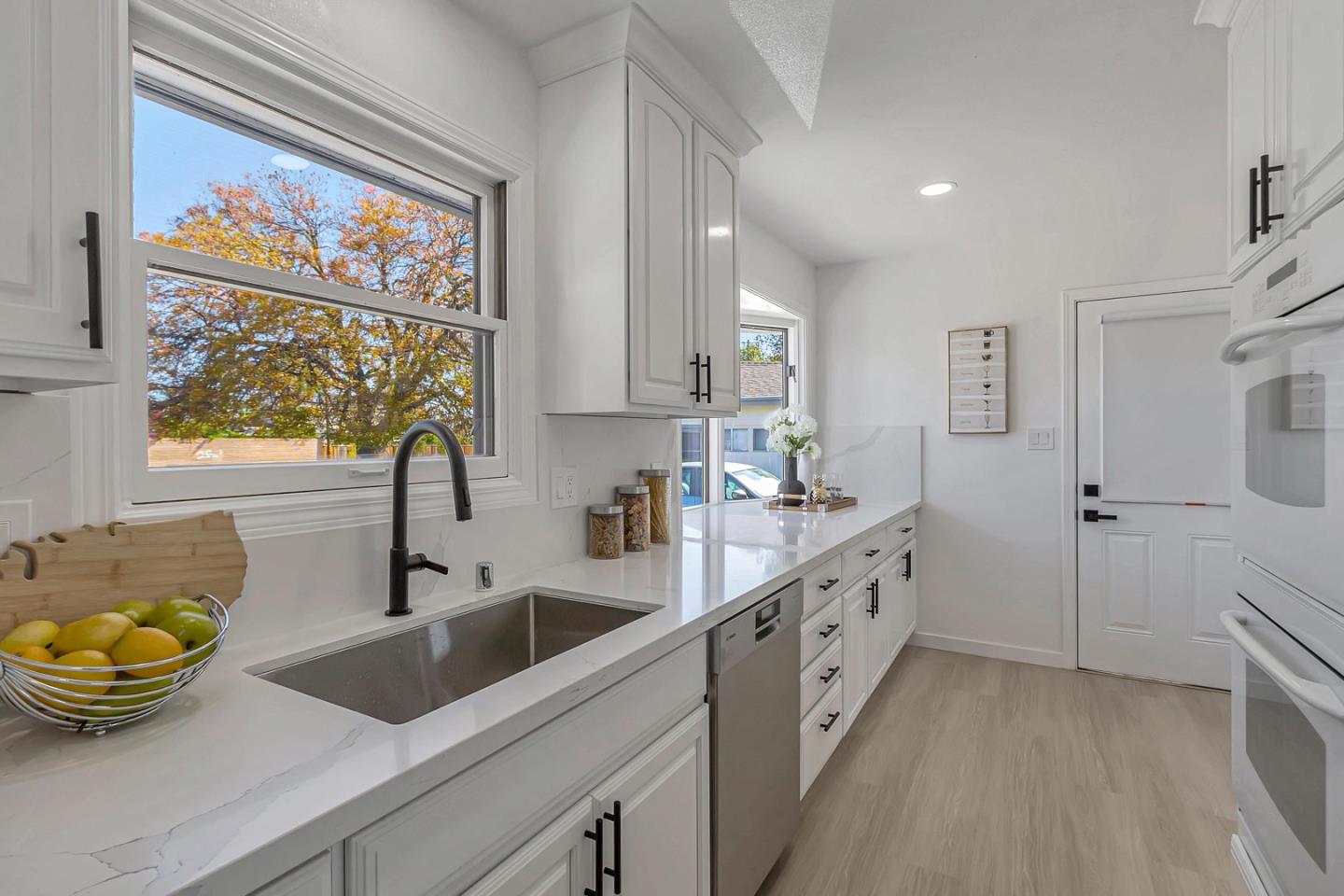 6722 Bollinger Road San Jose, CA 95129 - Photo 10 of 33 a kitchen with sink cabinets and window