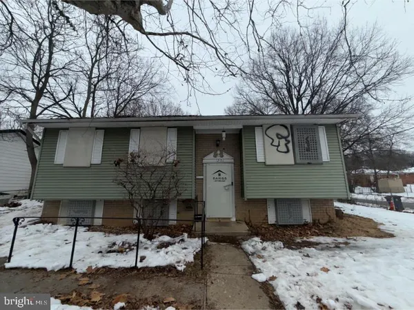 a front view of a house with parking