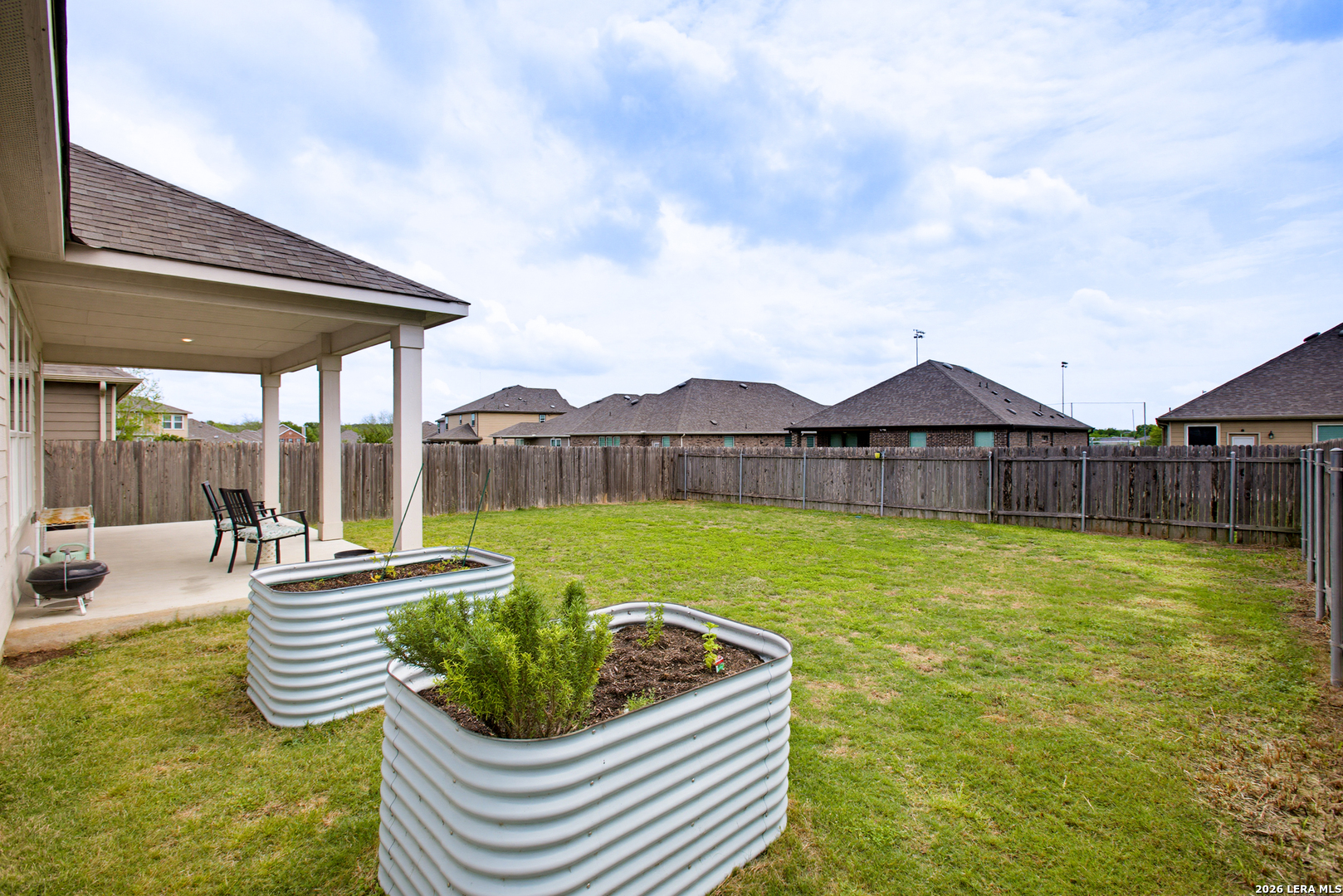 7829 Big Wind Way Austin, TX 78724 - Photo 22 of 26 a swimming pool with outdoor seating and yard