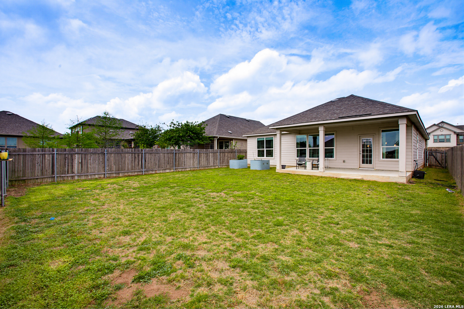 7829 Big Wind Way Austin, TX 78724 - Photo 24 of 26 a view of a house with a backyard