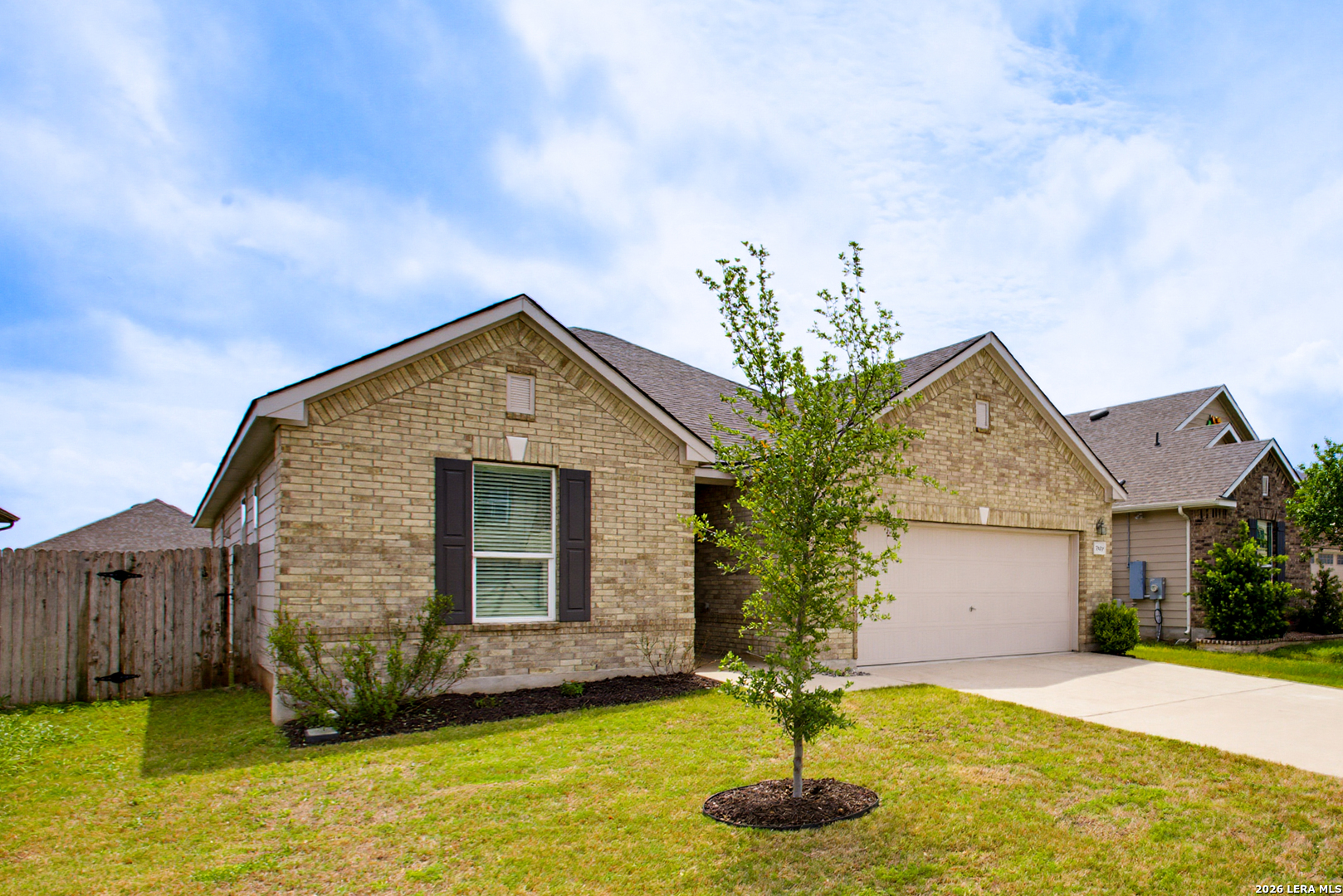 7829 Big Wind Way Austin, TX 78724 - Photo 3 of 26 a front view of a house with yard and garage