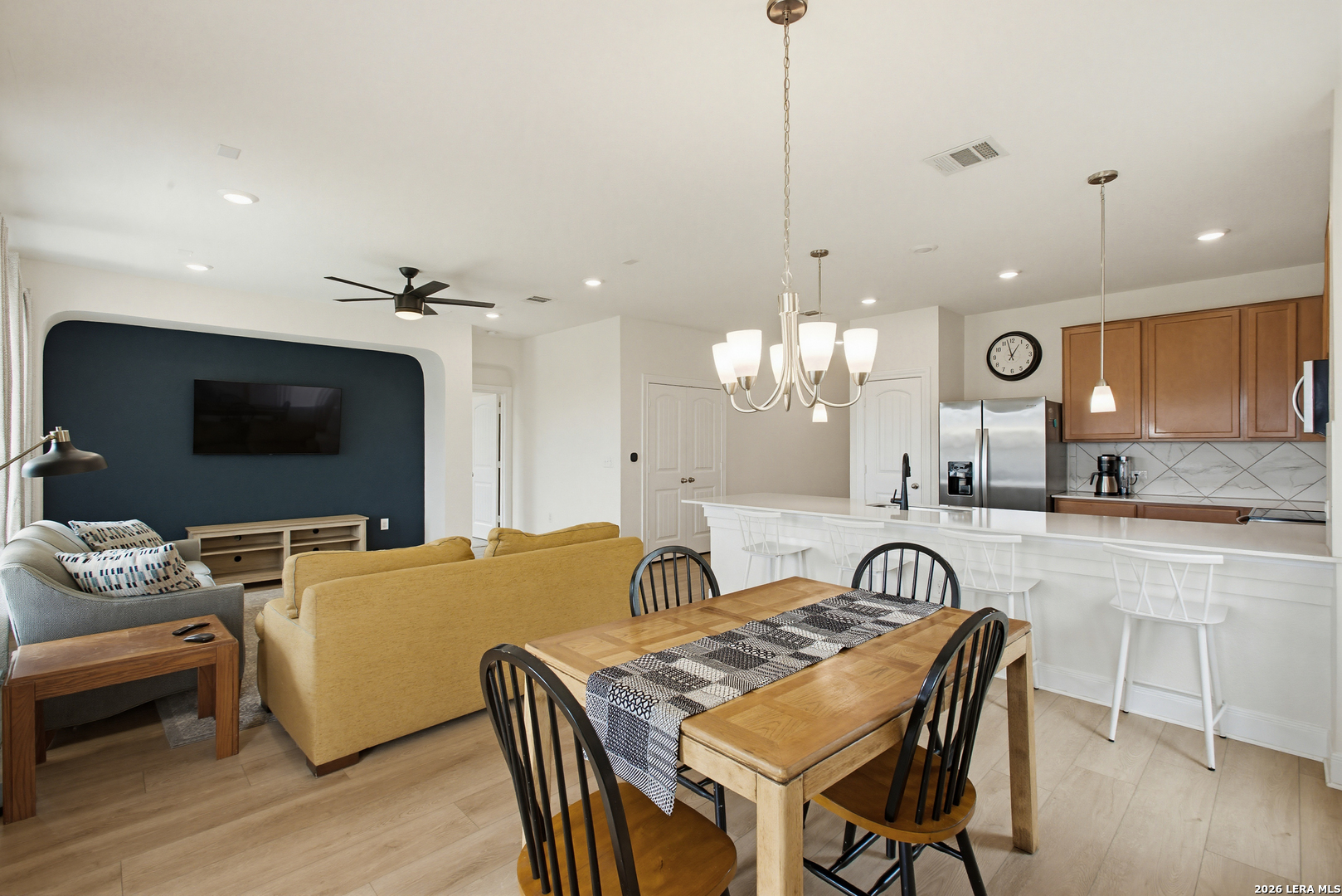 7829 Big Wind Way Austin, TX 78724 - Photo 4 of 26 a view of a dining room with furniture and wooden floor
