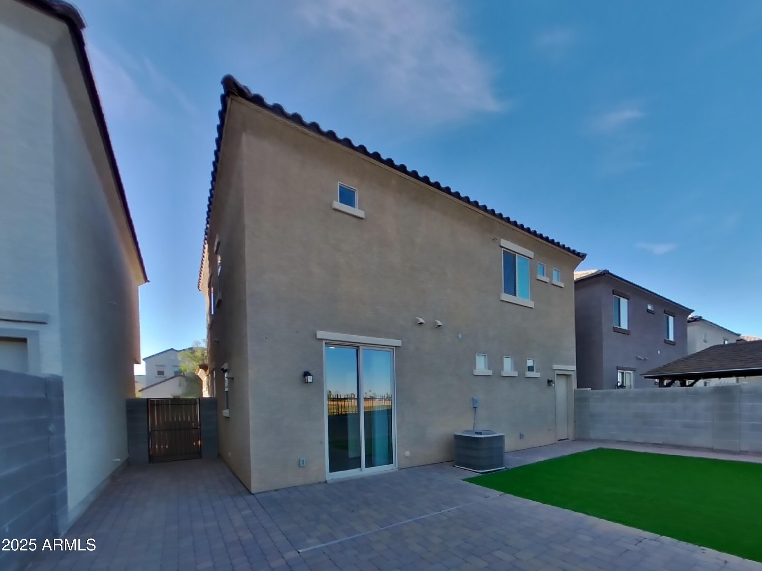 10336 West Devonshire Avenue Phoenix, AZ 85037 - Photo 17 of 18 a backyard of a house with lots of green space