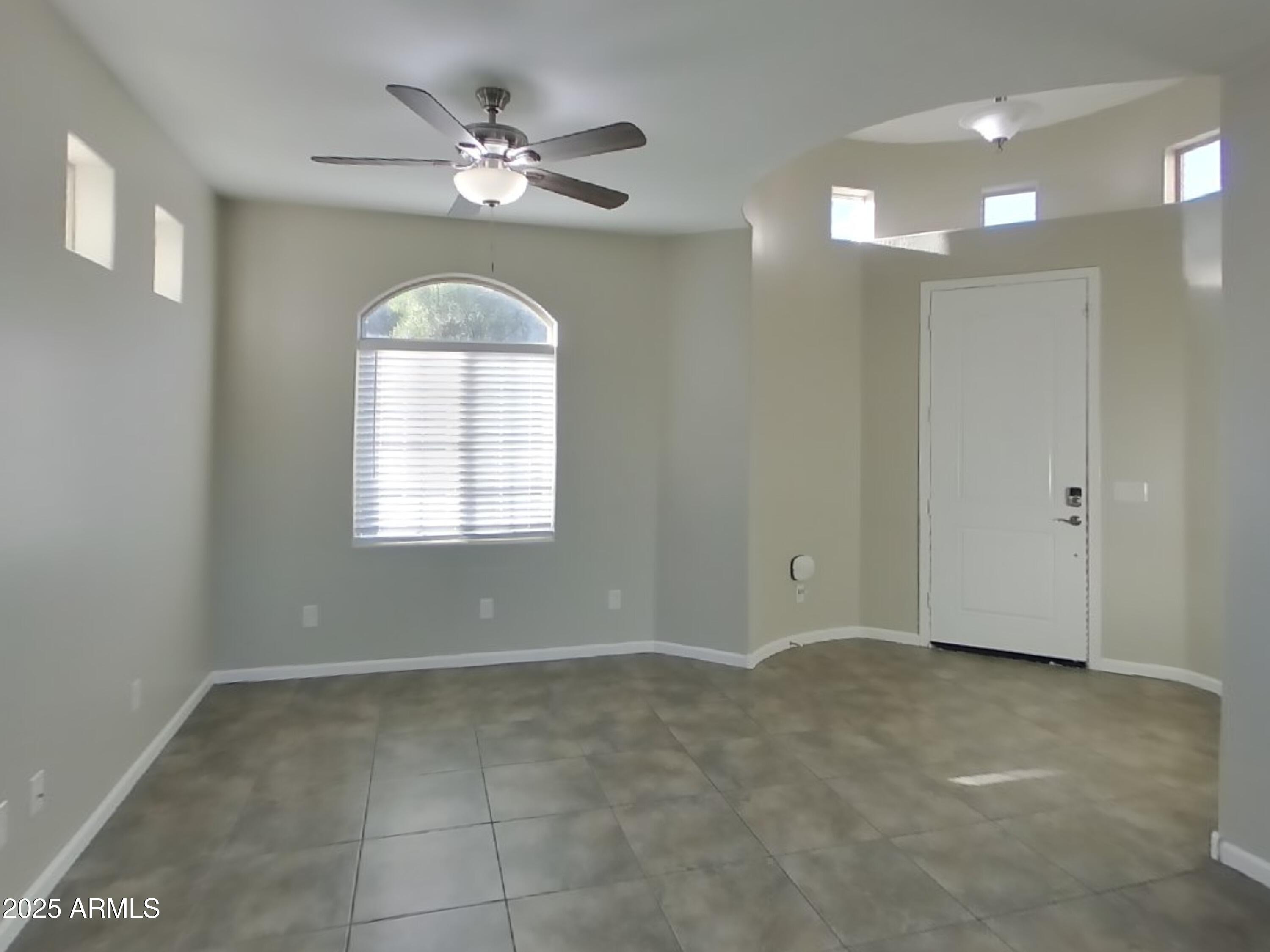 10336 West Devonshire Avenue Phoenix, AZ 85037 - Photo 2 of 18 a view of an empty room with a window