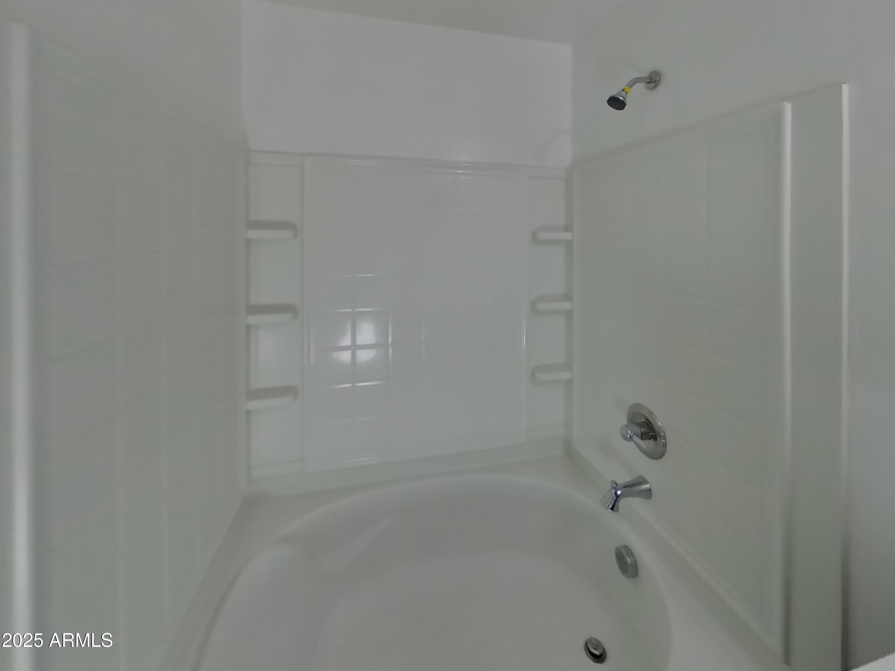 10336 West Devonshire Avenue Phoenix, AZ 85037 - Photo 9 of 18 a close up of a bathtub