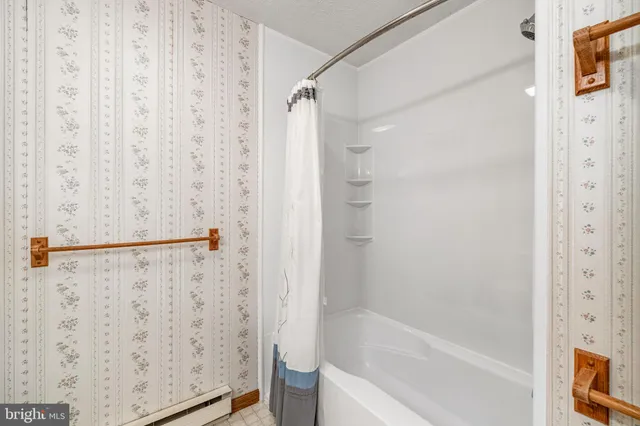 a bathroom with a double vanity sink and mirror