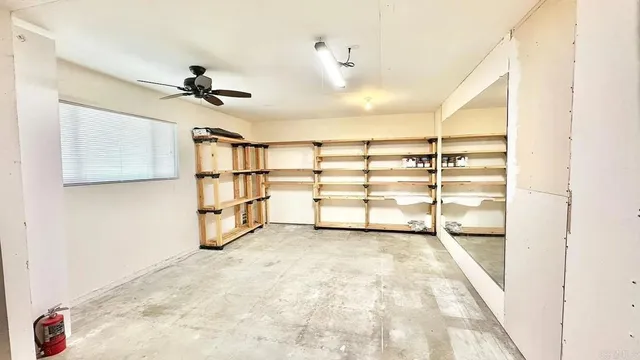 a view of a room with cabinet and mirrors