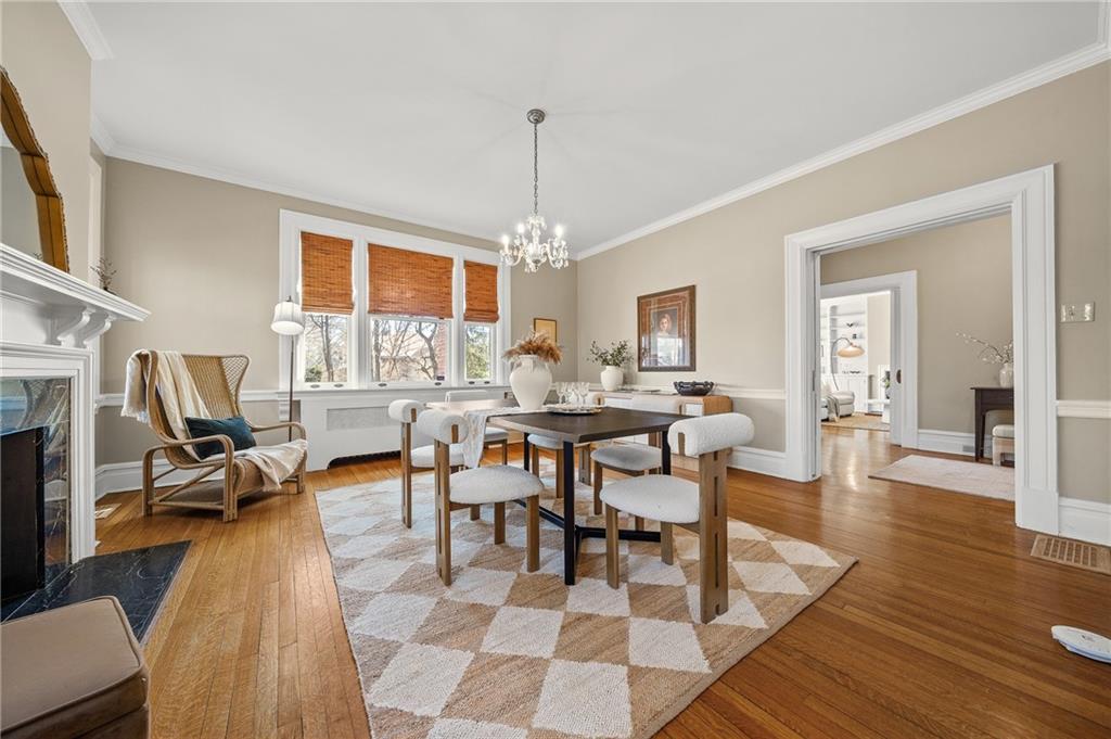 115 Woodland Road Pittsburgh, PA 15232 - Photo 15 of 50 a view of a dining room with furniture a rug and wooden floor
