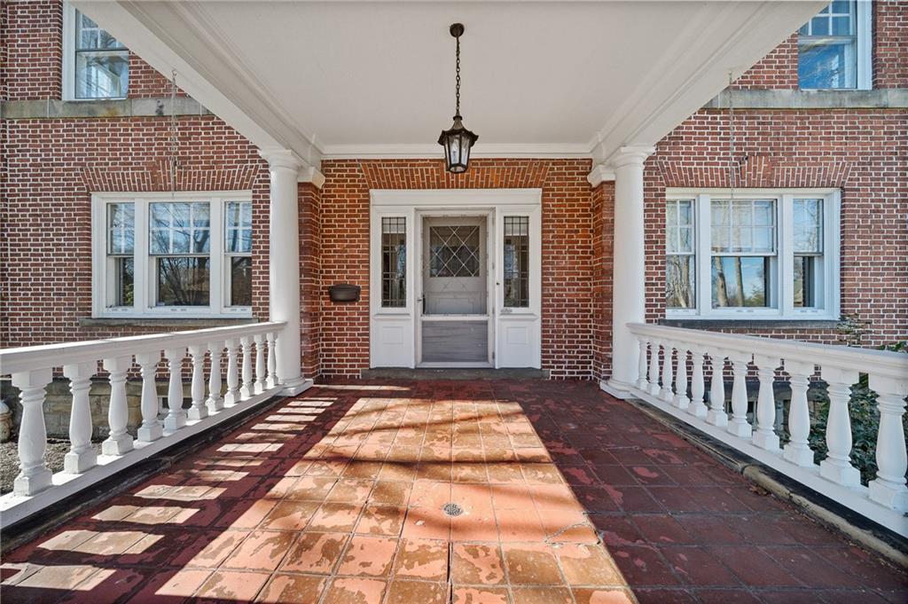 115 Woodland Road Pittsburgh, PA 15232 - Photo 2 of 50 a view of a brick house with large windows